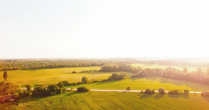 Flight Over a Large Green Field