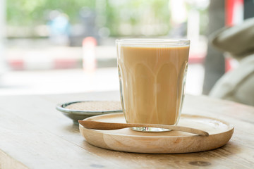 Coffee cup with crackers on wood table
