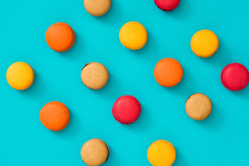 Colored macaroons on blue background

