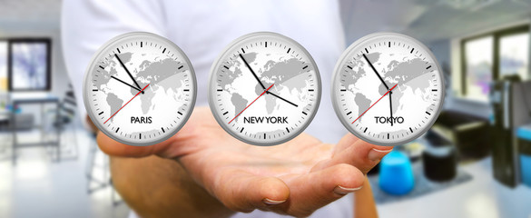 Businessman holding time of the world in his hand