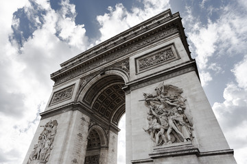 Obraz premium Triumphal arch. Paris. France. View of Place Charles de Gaulle. Famous touristic architecture landmark in summer day. Napoleon victory monument. Symbol of french glory. World historical heritage.