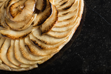 Apple pie background. Traditional french sweet dessert. Delicious, appetizing, homemade tart with slices of fresh fruits. Copy space, closeup
