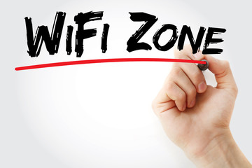 Hand writing WiFi Zone with marker, concept background