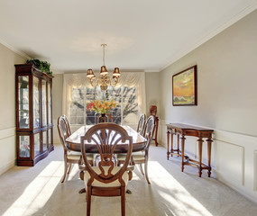 Dining area with antique furniture and carpet floor