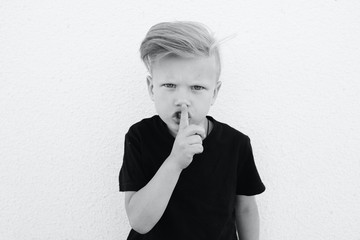young emotional boy on bright background