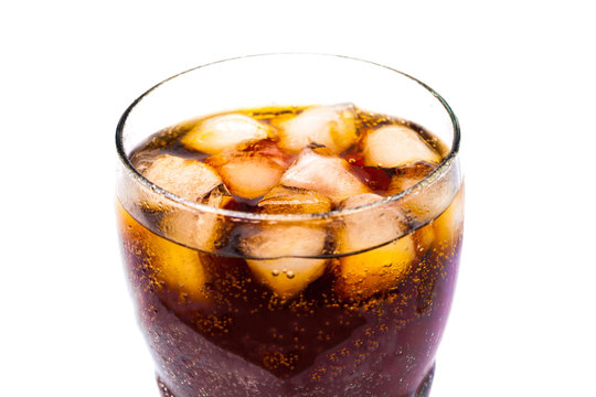 Top view of cola soft drink with ice in glass