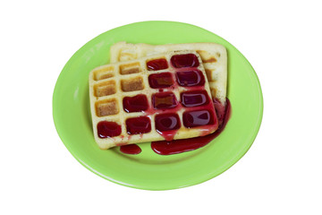 Viennese waffles with sweet  jam on a plate - isolated on a white background.