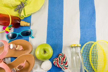 Summer accessories on beach towel