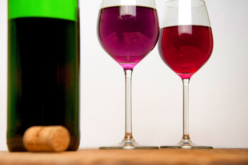 Wine glass and bottle on a wooden table