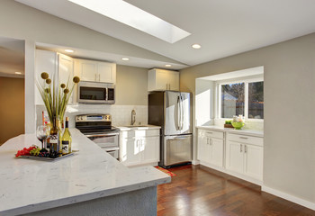 Kitchen room interior with white cabinets, hardwood floor