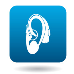 Hearing aid on an ear icon icon in simple style on a white background