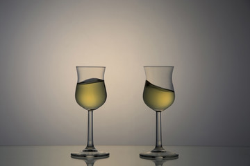 couple of marc glasses / backlit portrait of tasting glasses with marc