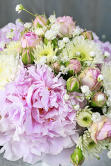 Floral arrangement with pink peonies
