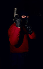 Fototapeta na wymiar gangster with gun in mask