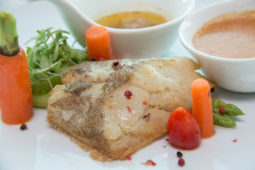 Grill a fish with vegetable and sauce