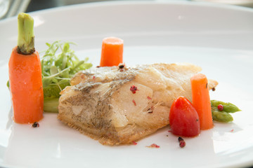 Grill a fish with vegetable and sauce