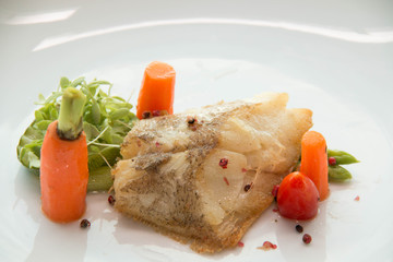 Grill a fish with vegetable and sauce