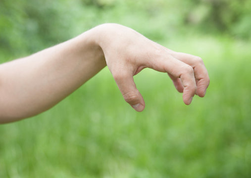 Male hand demonstrating a sign of an aggression
