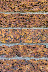 red laterite stone wall in chatuchak park bangkok thailand
