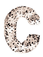 the letter C made from jigsaw