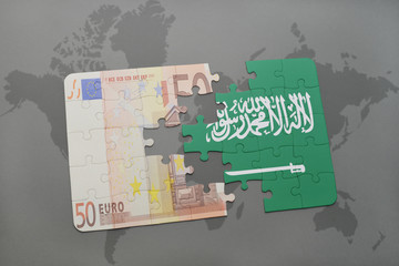 puzzle with the national flag of saudi arabia and euro banknote on a world map background.