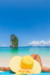 Fototapeta na wymiar Woman relaxing on a tropical beach