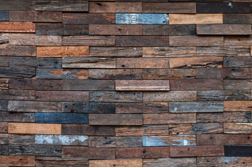 exposed wooden wall exterior, patchwork of raw wood forming a beautiful parquet wood pattern,Wood wall pattern