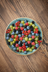 berries on wooden background