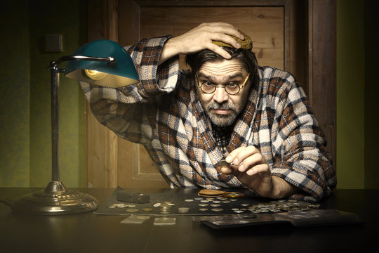 Curmudgeon counting coins at home
