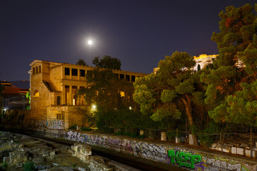 Fototapeta na wymiar Full moon over Stoa and ruins of the Ancient Agora in Athens, Greece.