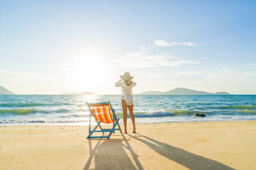 Young woman in hat on beach