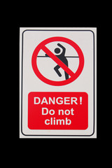 Isolated sign of "DANGER! Do not climb" with black background