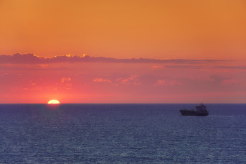 Fototapeta na wymiar cargo ship at sunset