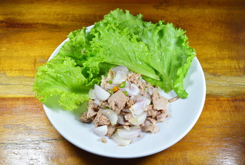 spicy tuna salad with lettuce on dish