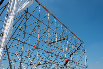 scaffolding for open air theatre against blue sky