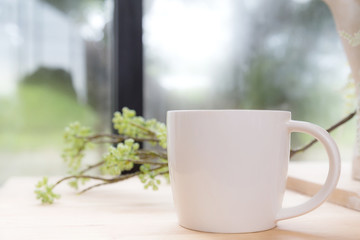 white coffee mug on the wooden table 