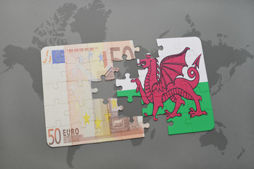 puzzle with the national flag of wales and euro banknote on a world map background.