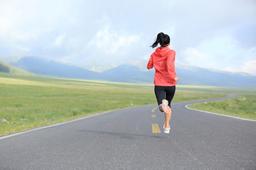 healthy lifestyle young fitness woman runner running on road