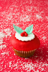 Christmas cupcakes on red background

