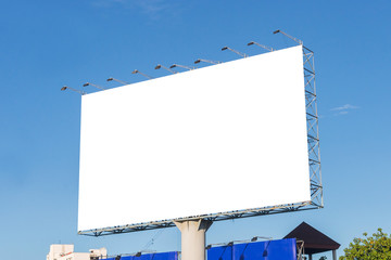 large blank billboard on road with city view background