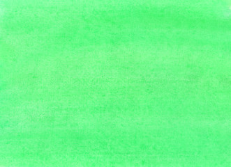 The texture of a sheet of paper painted with light green paint