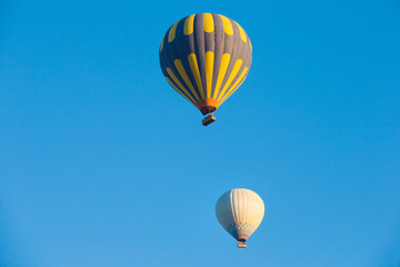  air balloons flying over the valley at Cappadocia