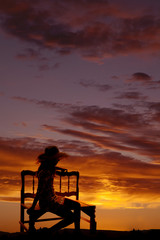 silhouette of girl on bench