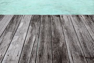 wooden pier against blue sea