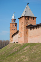 Fototapeta na wymiar Two ancient towers in the Novgorod fortress close up, sunny april day. Veliky Novgorod, Russia