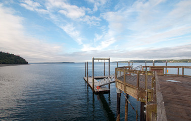 Fototapeta na wymiar Joemma Beach State Park Pier and Boat Dock on the Puget Sound near Tacoma Washington USA