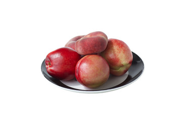 Peaches and nectarines on the plate.