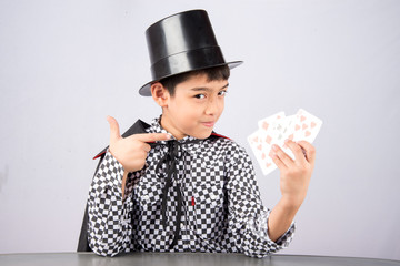Little boy pretend as a magician performance with fun
