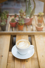hot latte art on wood table background