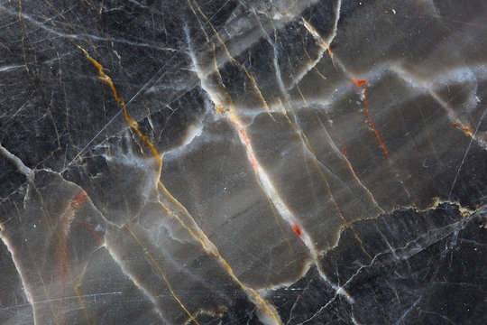 Close up of Dark gray marble (Russia Gold) with a beautiful pattern. Nature background for interior and other design.